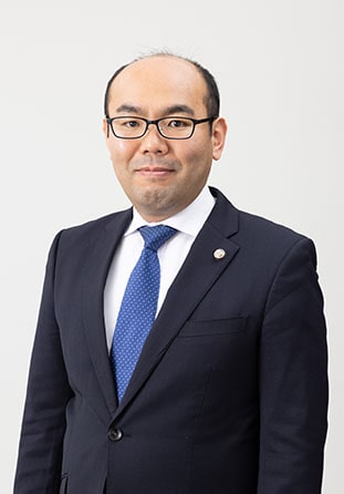 弁護士根來 真一郎